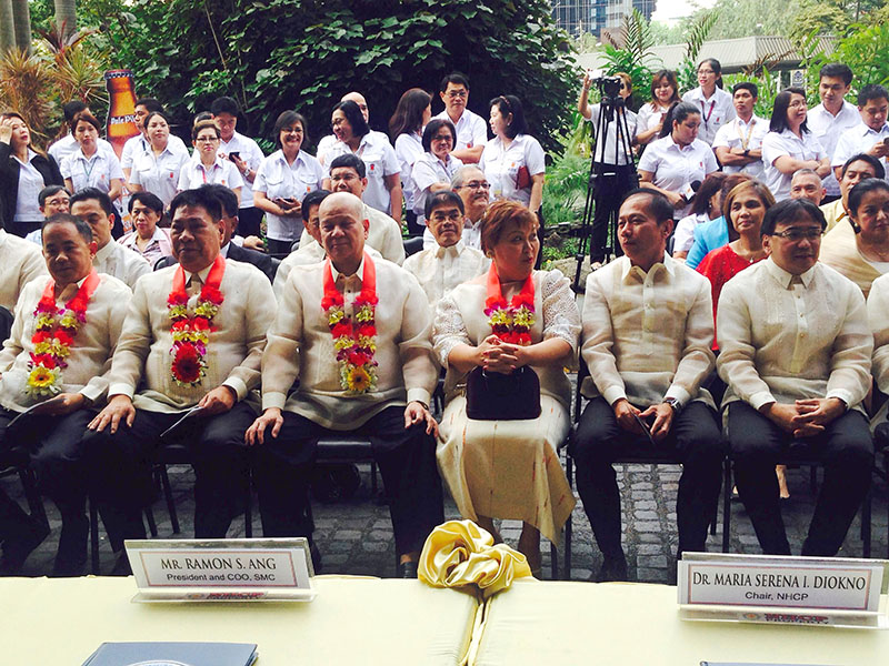 BEEF UP BUSINESSES. 'We'll continue to manage our existing businesses and hopefully pursue more acquisitions,' says Ramon Ang (second from right, seated). Photo by Chrisee Dela Paz / Rappler   